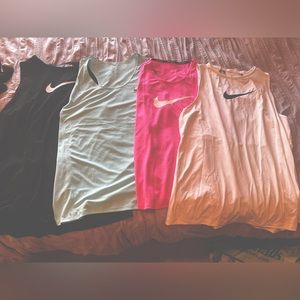 Four size large/extra large Nike workout tops all new without tags